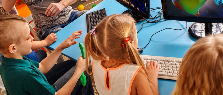 Image Showing Cute Happy Children Playing Video Games In PC.