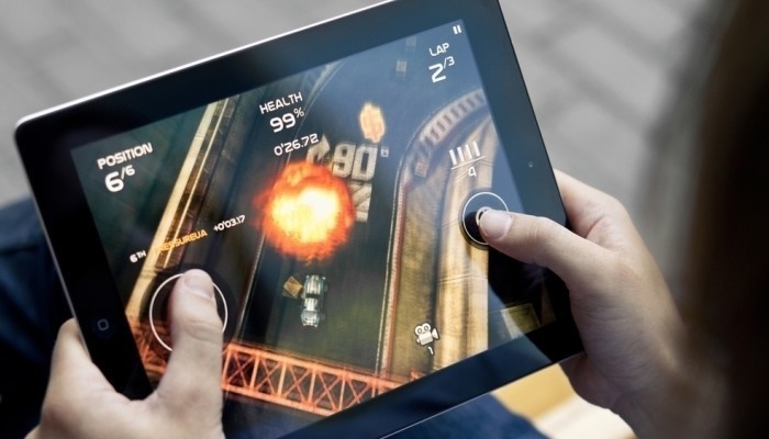 A Person Playing Game In His Digital Tablet